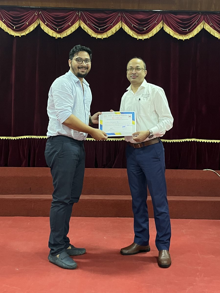 Dr. Gaurav Das on stage in Shillong, receiving his Indian Academy of Pediatrics CPR course certificate